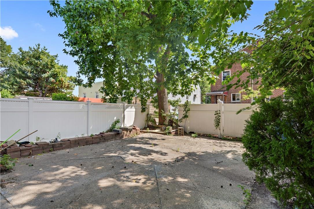 2726 Mickle Avenue Bronx, NY 10469 - Photo 15 of 16 a backyard of a house with a tree