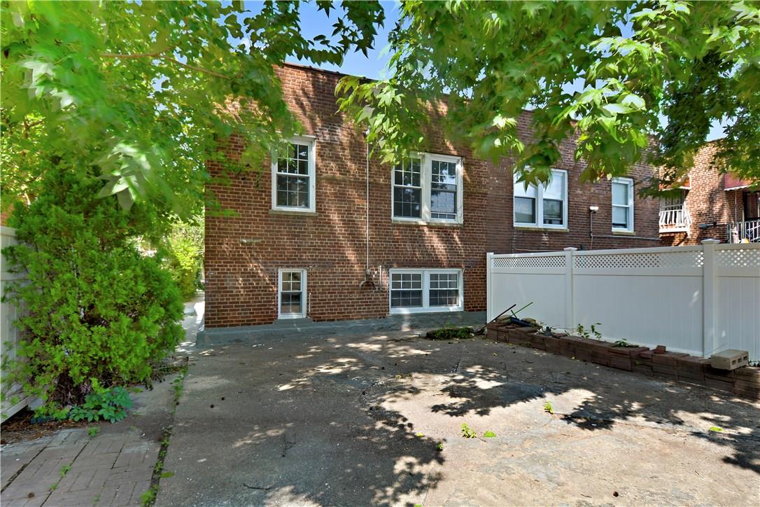 2726 Mickle Avenue Bronx, NY 10469 - Photo 16 of 16 a front view of a house with a tree