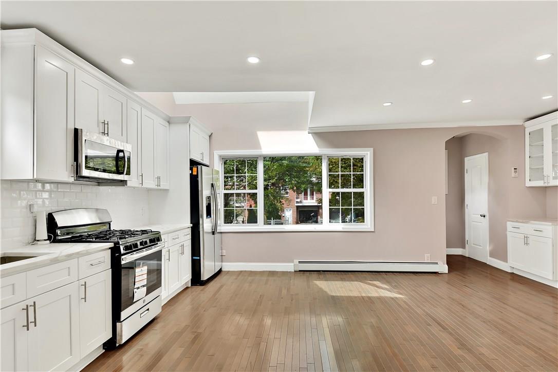 2726 Mickle Avenue Bronx, NY 10469 - Photo 2 of 16 a kitchen with stainless steel appliances granite countertop a stove and a sink