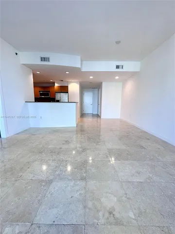 a view of a kitchen with furniture and a window