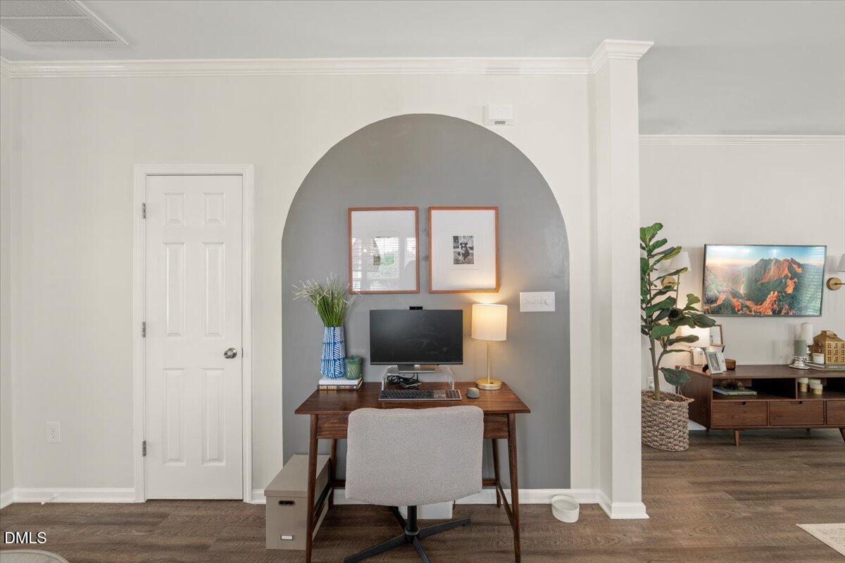 8449 Central Drive Raleigh, NC 27613 - Photo 7 of 38 a view of a workspace with a living room