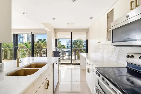 a kitchen with a large window and a sink