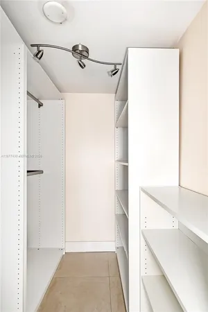 a bathroom with a shower and a sink