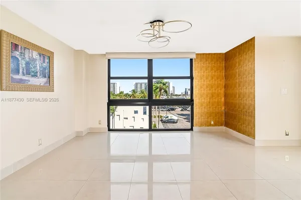 a view of an empty room with a window