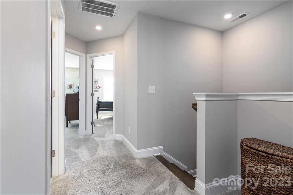 2036 Suttonview Road Fort Mill, SC 29708 - Photo 11 of 37 a view of livingroom with hardwood floor and a hallway
