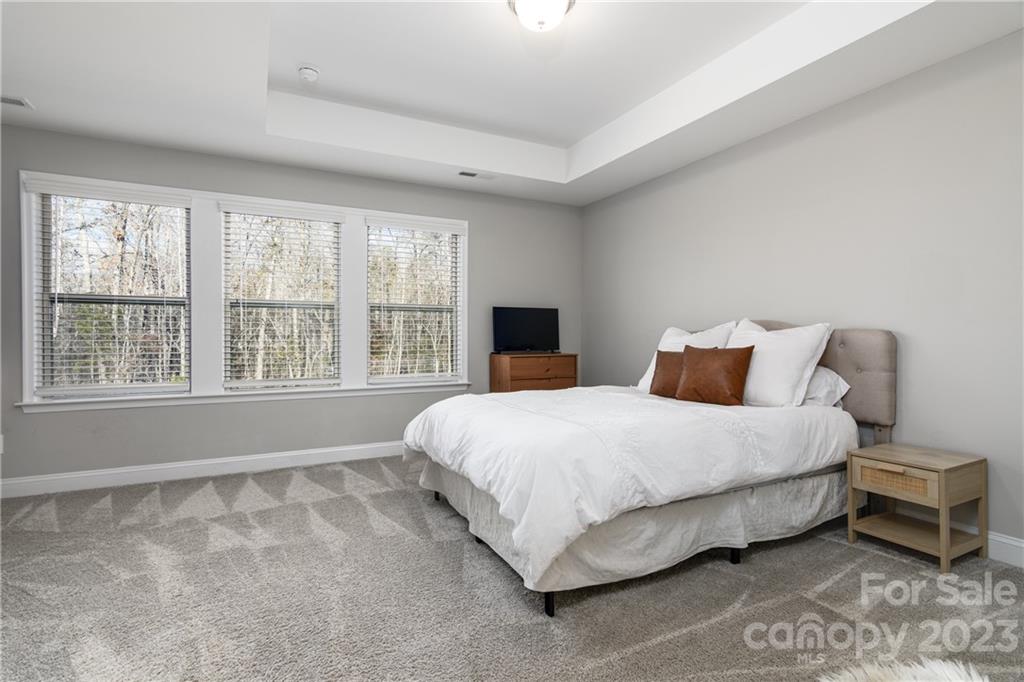 2036 Suttonview Road Fort Mill, SC 29708 - Photo 12 of 37 a large bed sitting in a bedroom next to a window