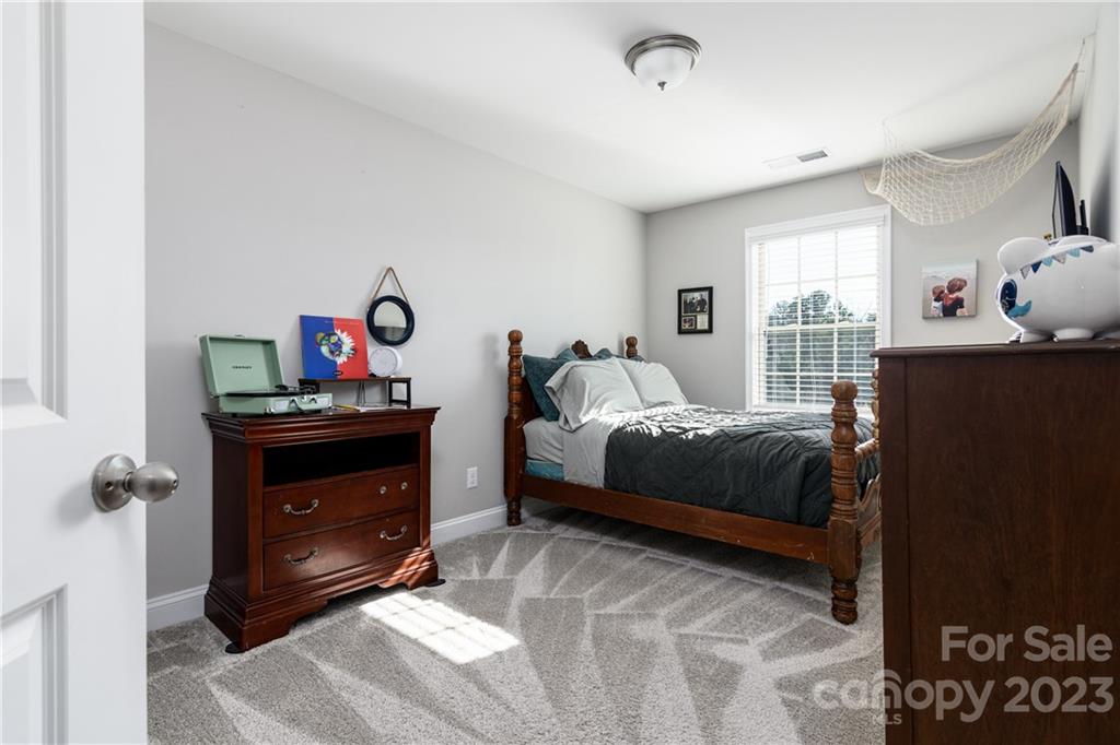 2036 Suttonview Road Fort Mill, SC 29708 - Photo 17 of 37 a bedroom with a bed and a window