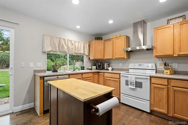 a kitchen with a stove a sink and a microwave