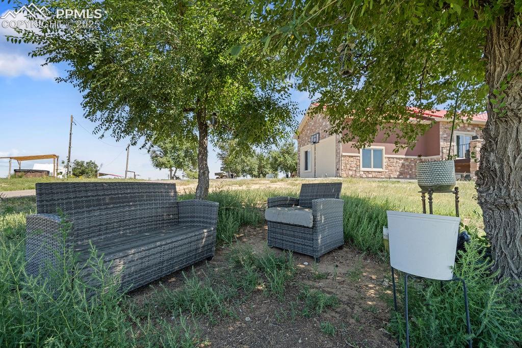8450 Edison Road Yoder, CO 80864 - Photo 45 of 50 a view of a chairs in a backyard