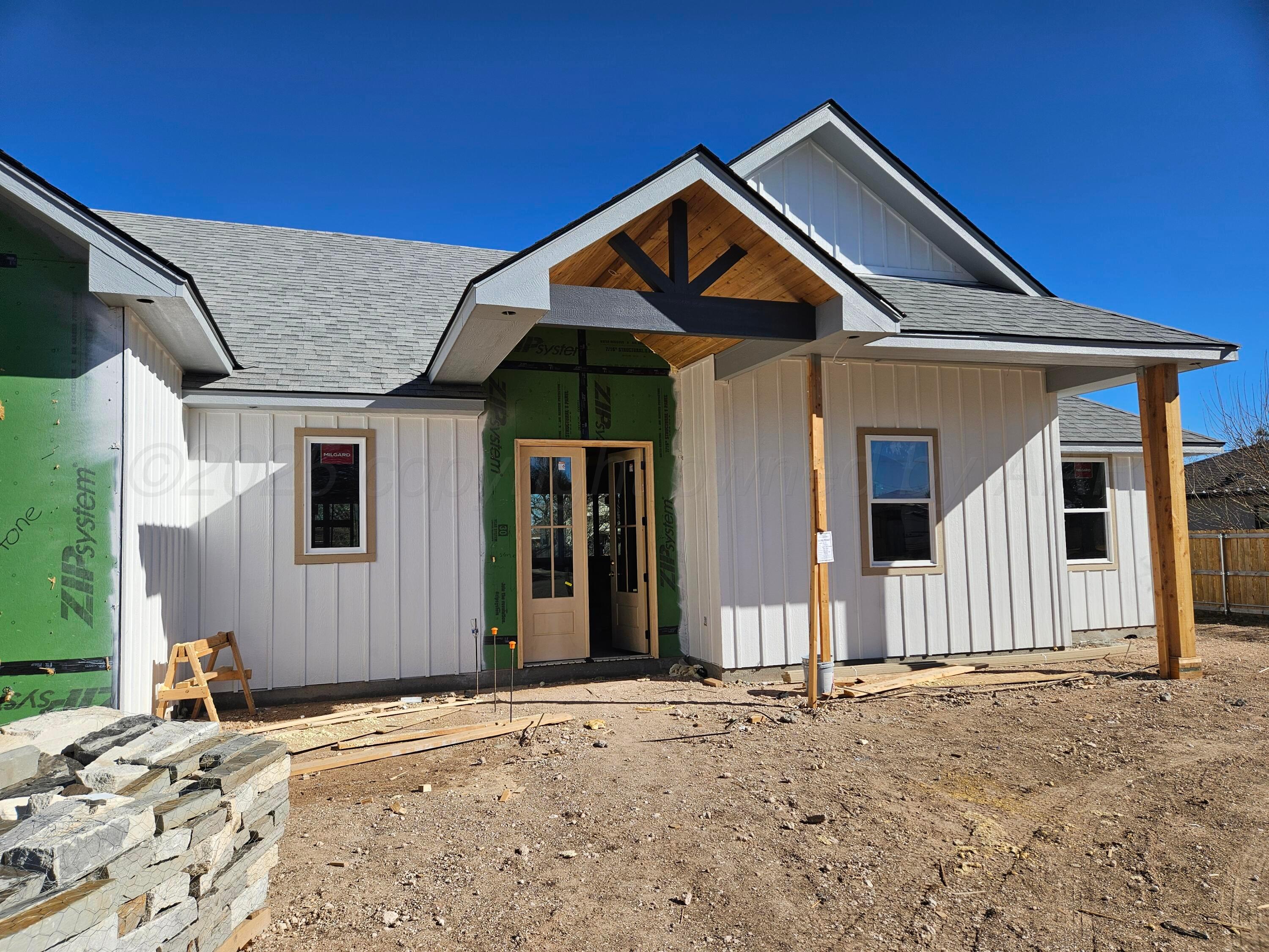 1010 Oak Avenue Panhandle, TX 79068 - Photo 6 of 9 a front view of a house with a yard