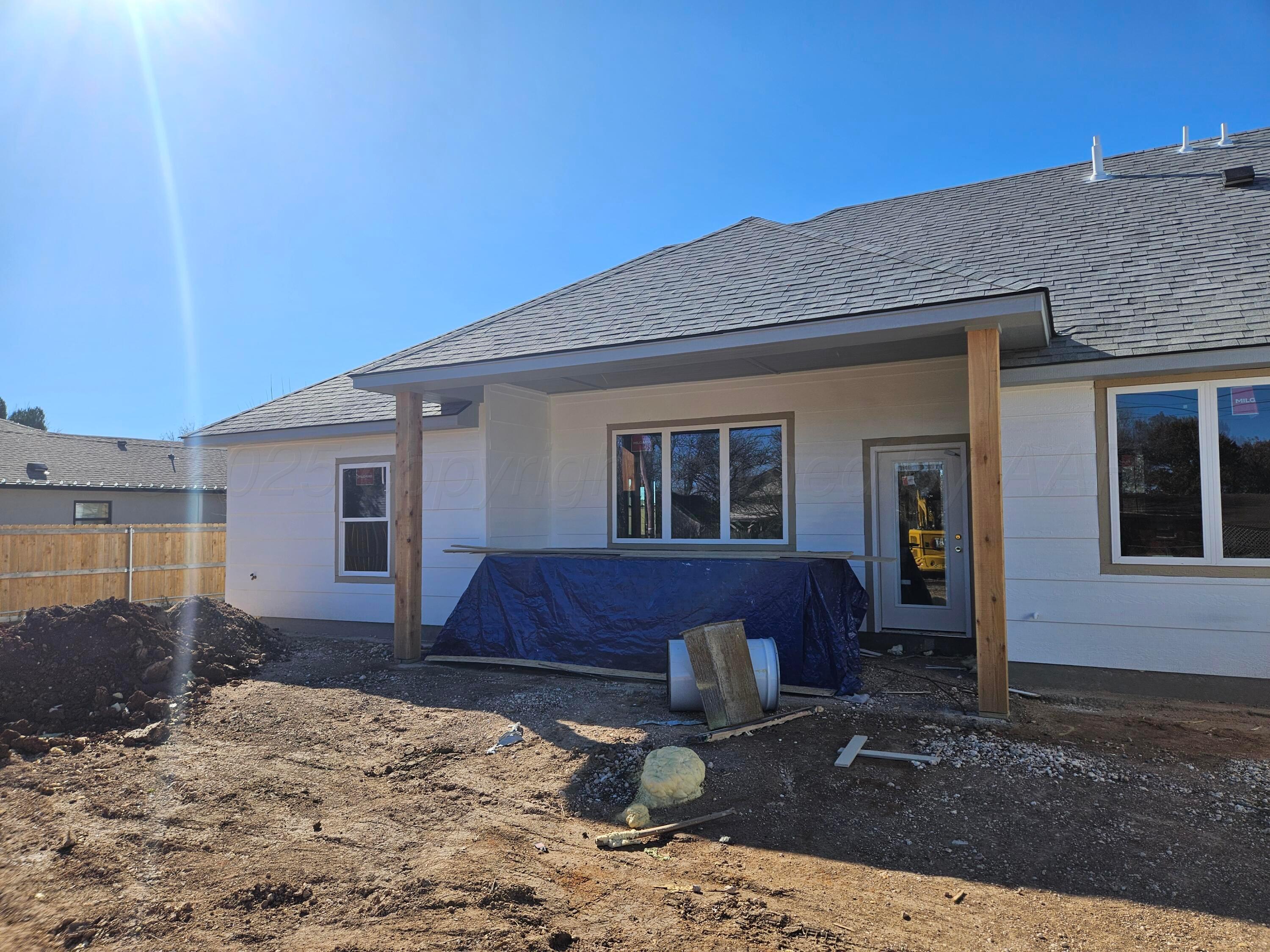 1010 Oak Avenue Panhandle, TX 79068 - Photo 9 of 9 a front view of a house with a yard
