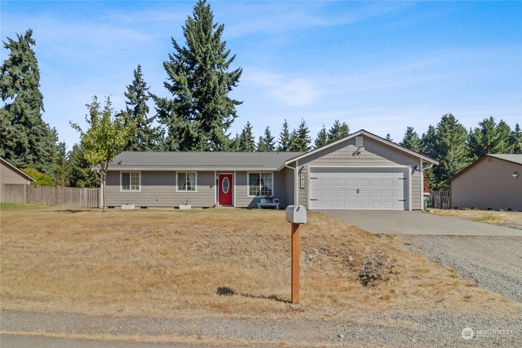 5412 187th Court Southwest Rochester, WA 98579 - Photo 1 of 37 a front view of a house with a yard