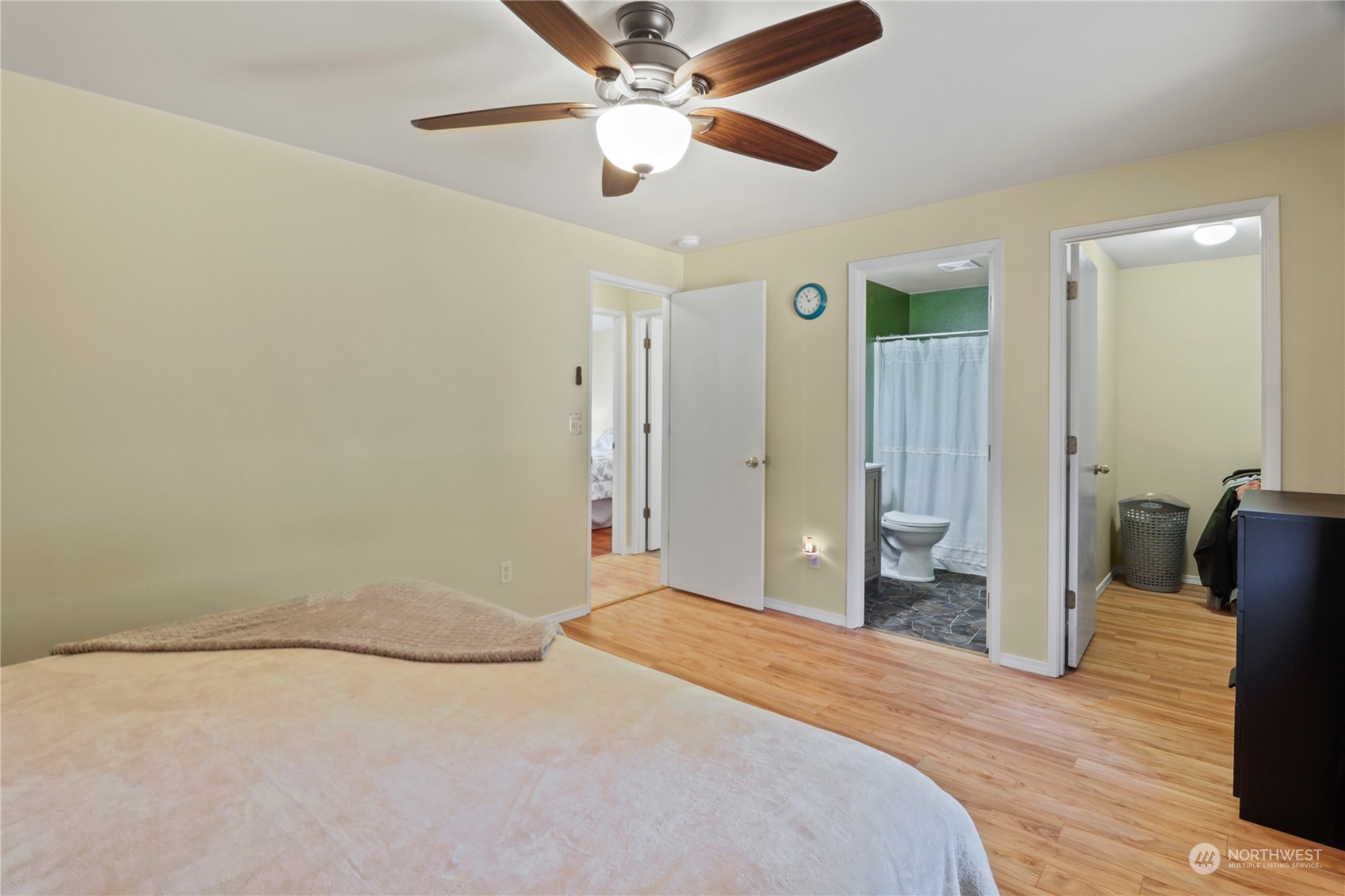 5412 187th Court Southwest Rochester, WA 98579 - Photo 16 of 37 a bedroom with a bed and a chandelier