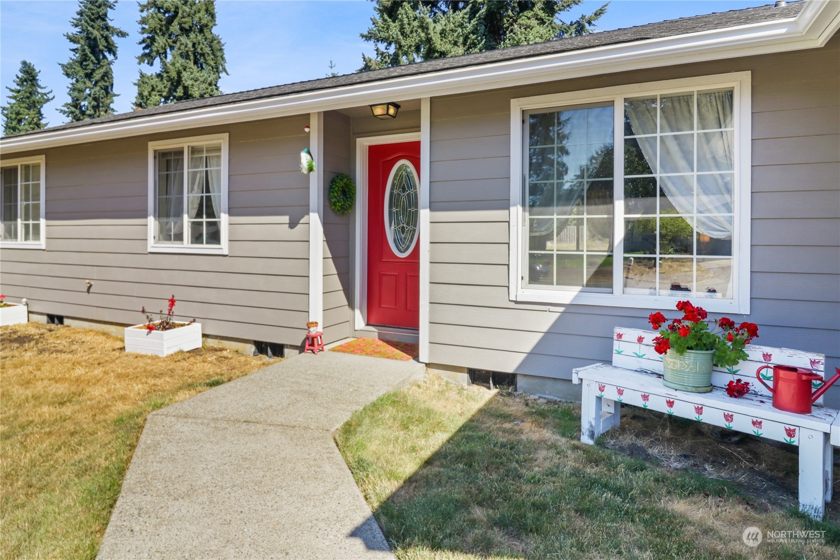 5412 187th Court Southwest Rochester, WA 98579 - Photo 2 of 37 a backyard of a house with seating space