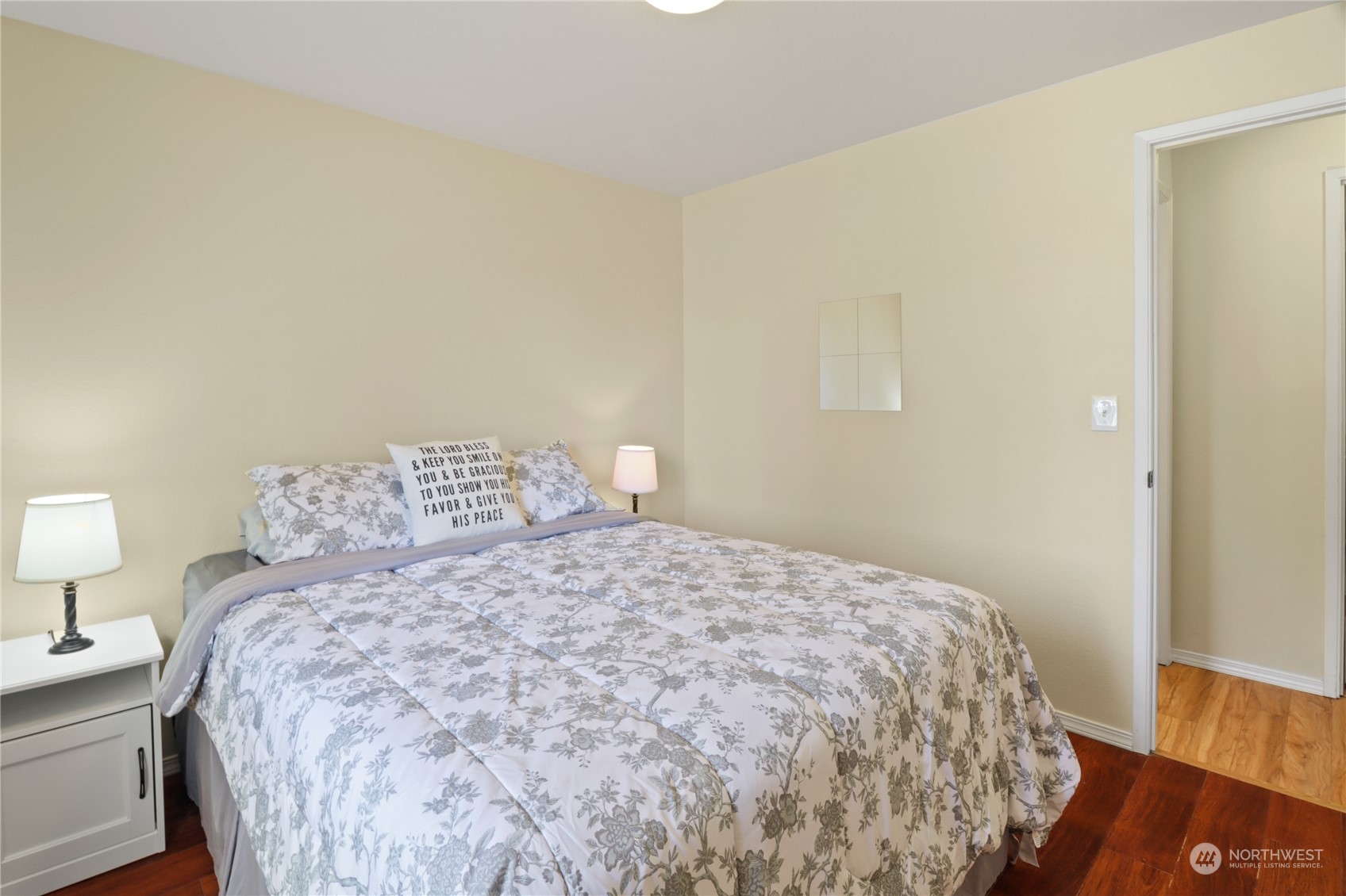 5412 187th Court Southwest Rochester, WA 98579 - Photo 21 of 37 a large bed sitting in a bedroom next to a lamp