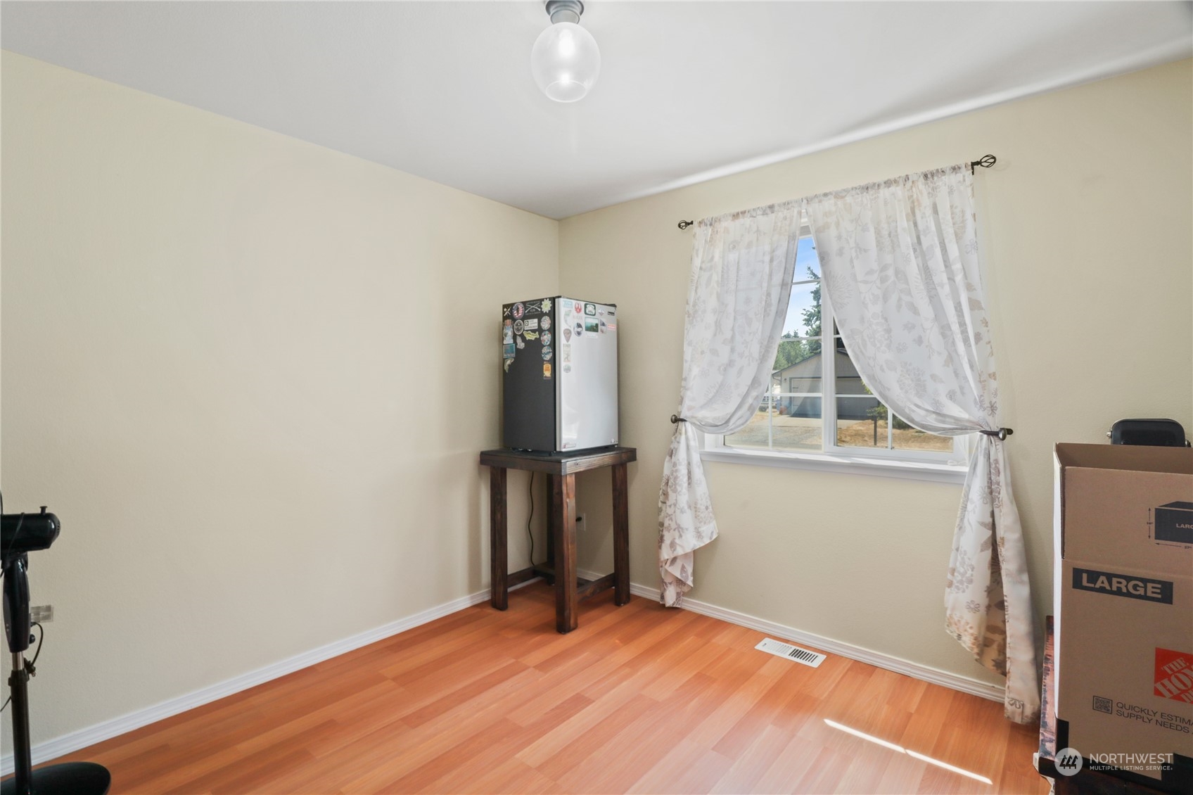 5412 187th Court Southwest Rochester, WA 98579 - Photo 25 of 37 a view of empty room with wooden floor and fan