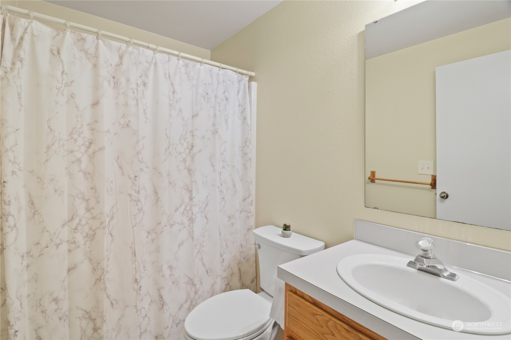 5412 187th Court Southwest Rochester, WA 98579 - Photo 27 of 37 a bathroom with a sink a toilet and a mirror