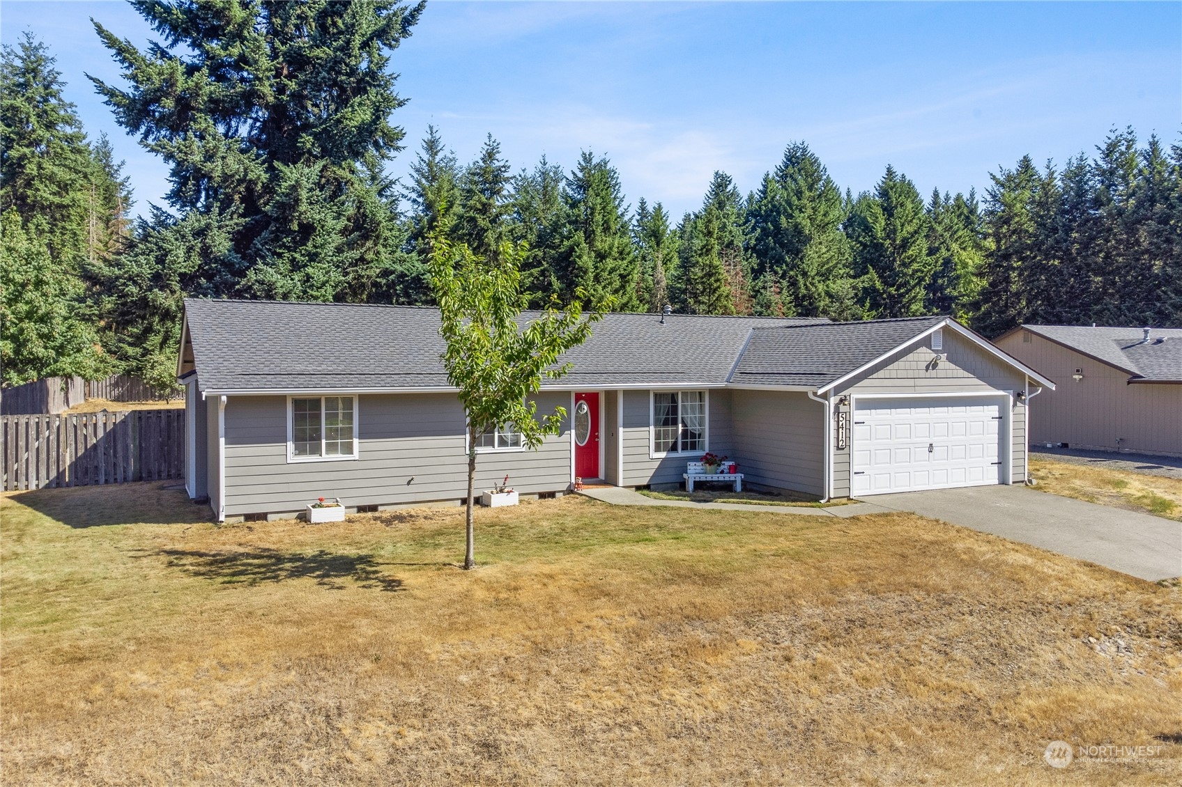 5412 187th Court Southwest Rochester, WA 98579 - Photo 36 of 37 front view of a house with a yard