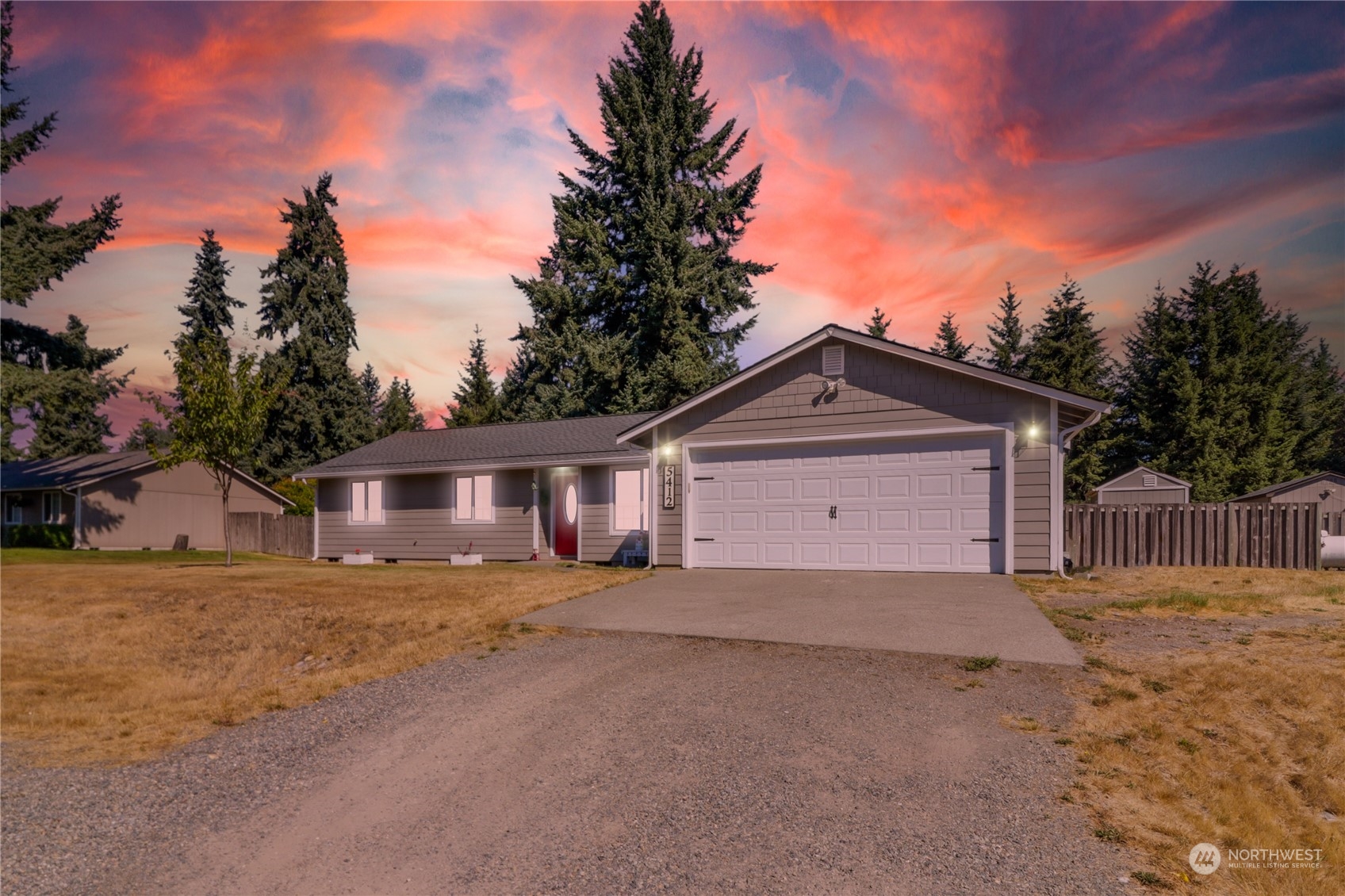 5412 187th Court Southwest Rochester, WA 98579 - Photo 37 of 37 a front view of a house with a yard and garage