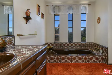 a view of a balcony with an outdoor seating