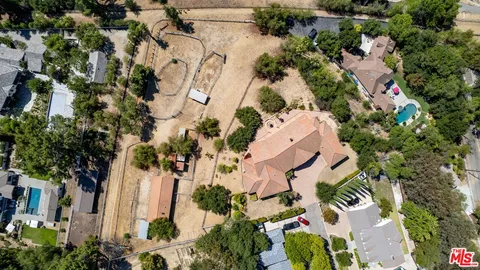 an aerial view of a houses with outdoor space