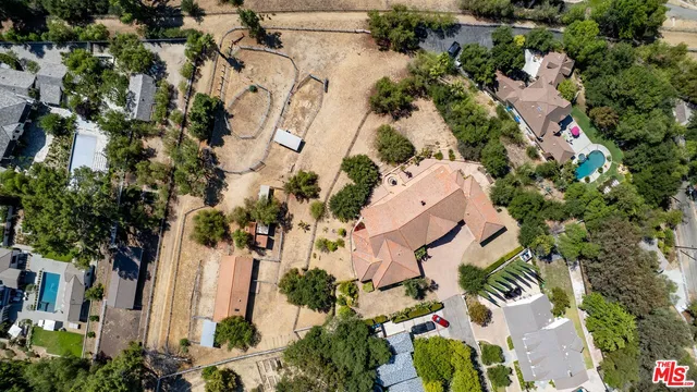 an aerial view of a houses with outdoor space