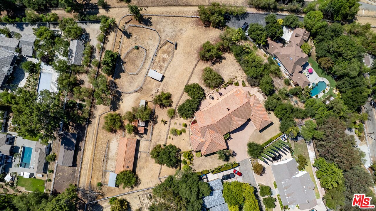 24926 Jim Bridger Road Hidden Hills, CA 91302 - Photo 35 of 40 an aerial view of a house with a yard and garden