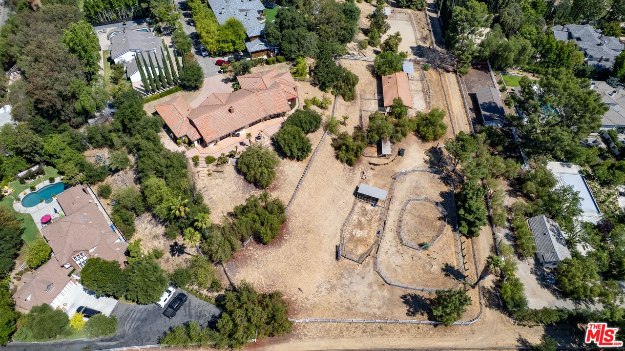 24926 Jim Bridger Road Hidden Hills, CA 91302 - Photo 38 of 40 an aerial view of a house with a yard and lake view