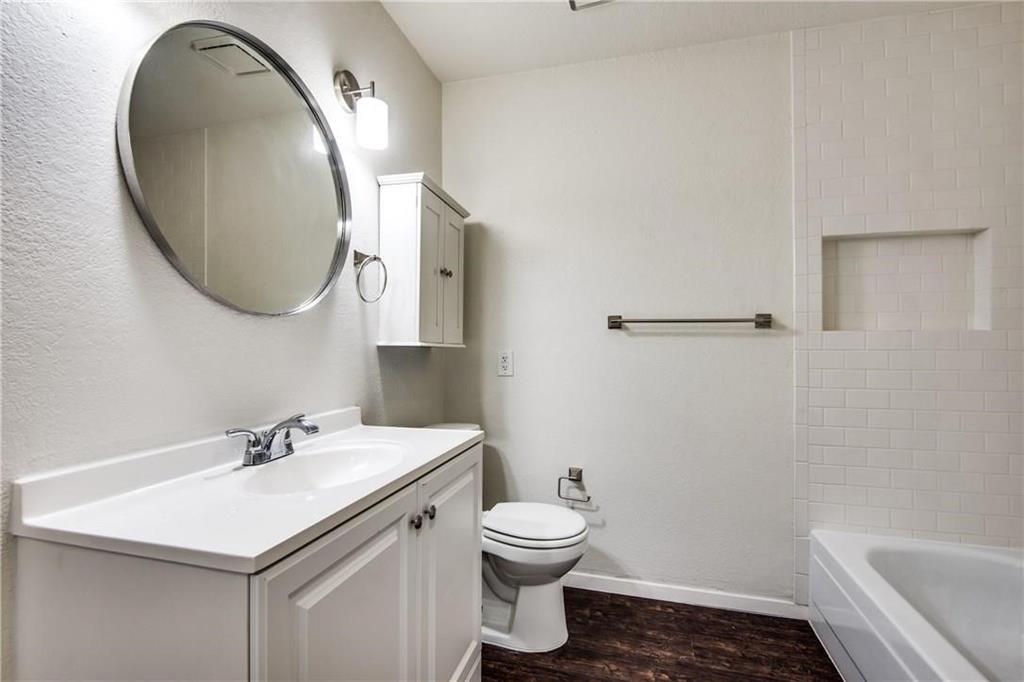 35 Abbey Road Euless, TX 76039 - Photo 11 of 25 a bathroom with a sink toilet and a mirror