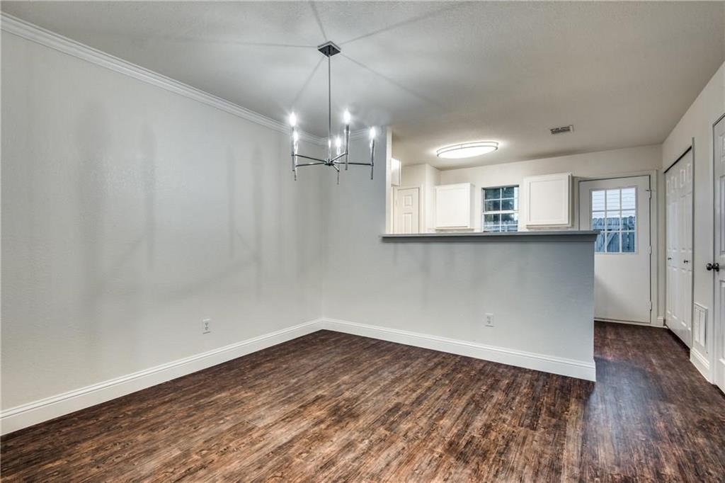 35 Abbey Road Euless, TX 76039 - Photo 18 of 25 an empty room with wooden floor and windows