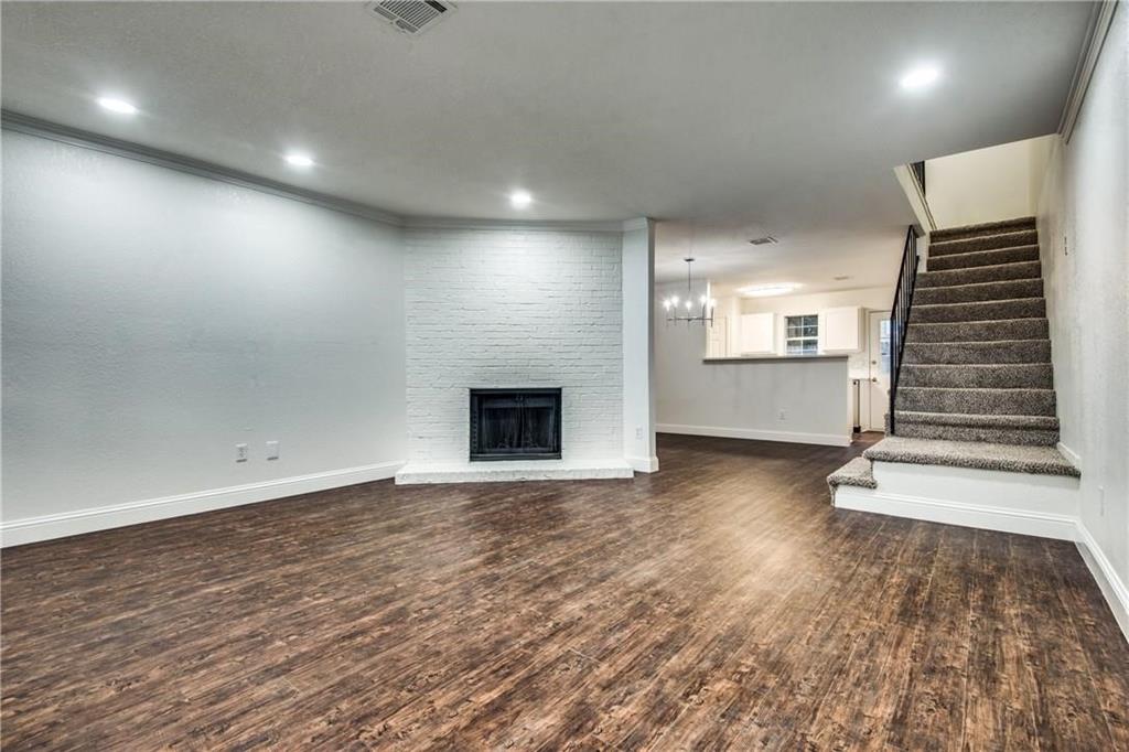 35 Abbey Road Euless, TX 76039 - Photo 22 of 25 an empty room with wooden floor and windows