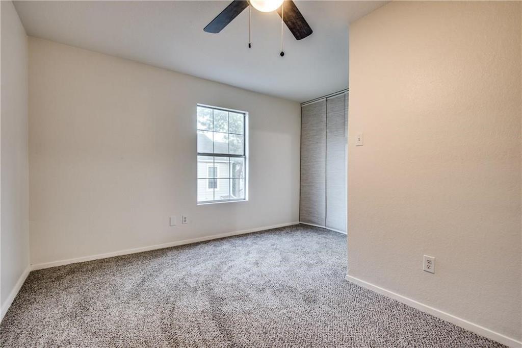 35 Abbey Road Euless, TX 76039 - Photo 6 of 25 an empty room with a ceiling fan and window