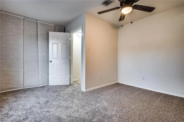 an empty room with fan