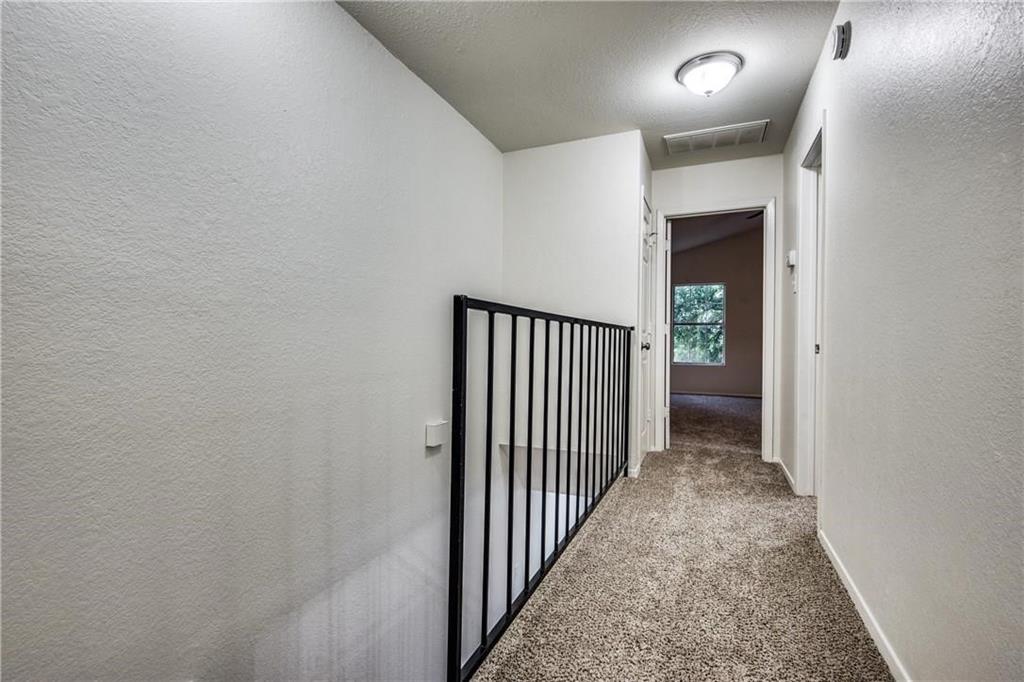 35 Abbey Road Euless, TX 76039 - Photo 9 of 25 a view of a hallway with wooden floor