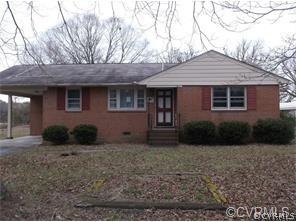 4612 Shop Street Chester, VA 23831 - Photo 1 of 1 a front view of a house with garden