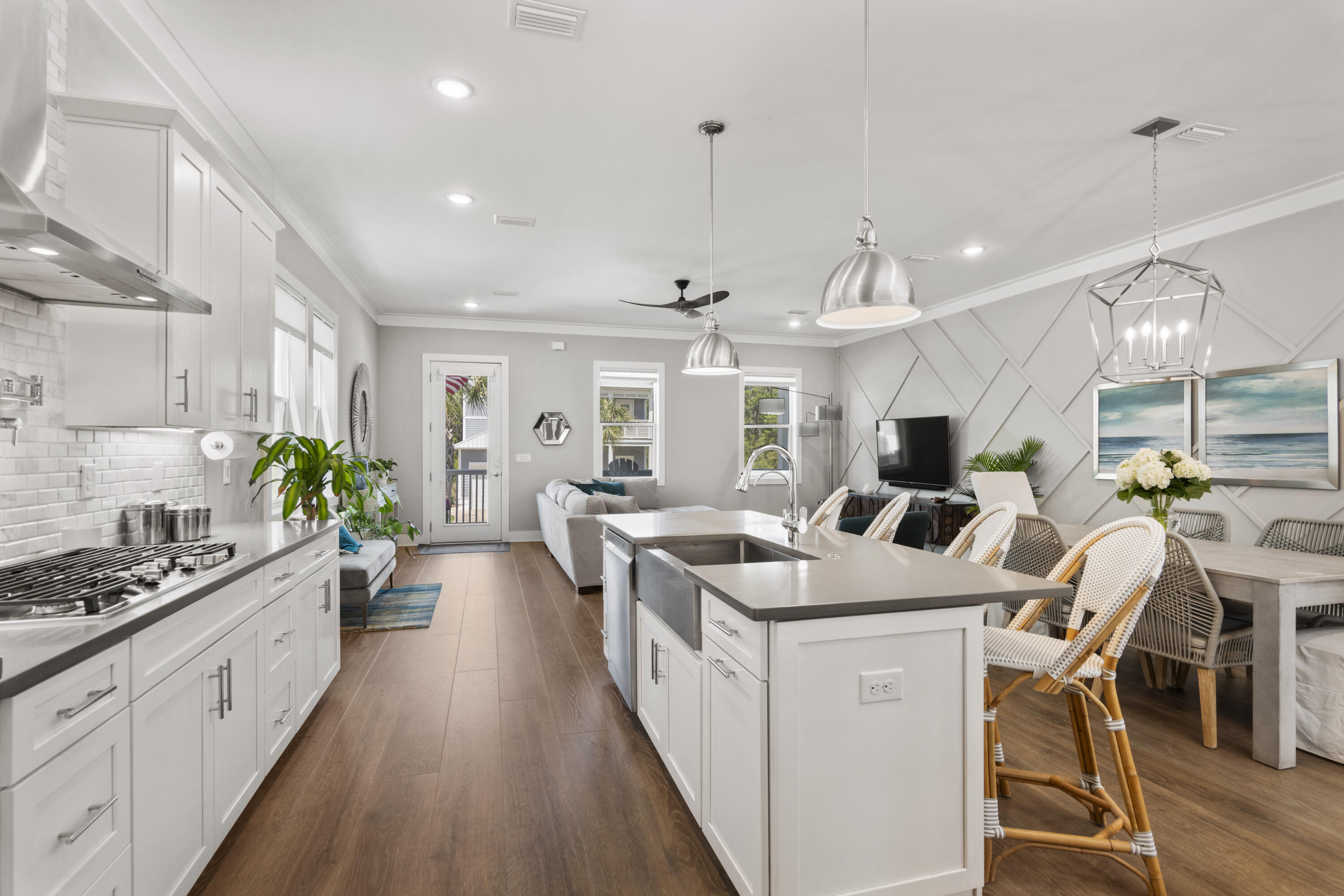 48 Lake Mist Ln Inlet Beach Inlet Beach, FL 32461 - Photo 14 of 78 a large white kitchen with lots of counter space a sink dining table and chairs