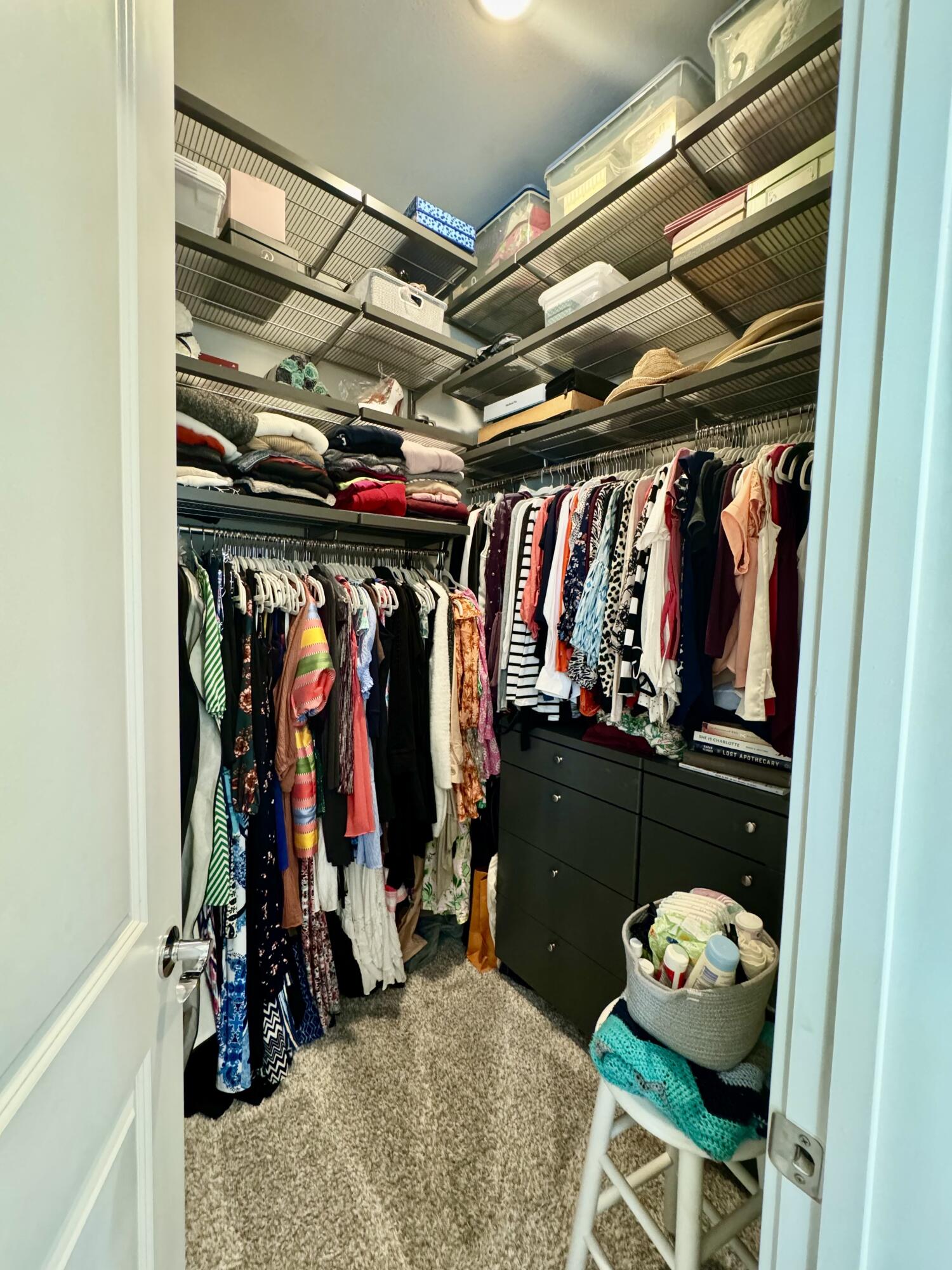 48 Lake Mist Ln Inlet Beach Inlet Beach, FL 32461 - Photo 26 of 78 a view of walk in closet with clothes and shoes