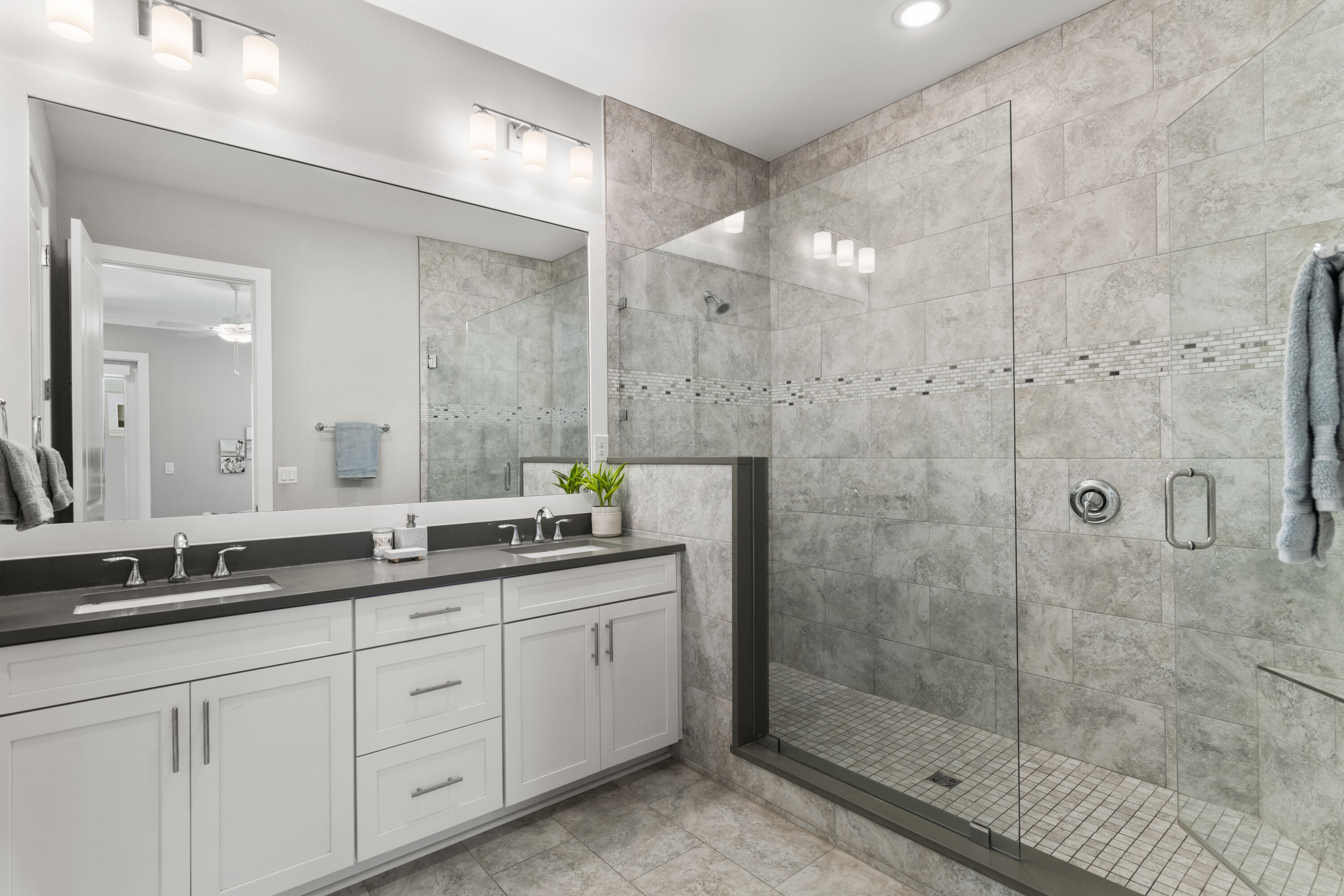 48 Lake Mist Ln Inlet Beach Inlet Beach, FL 32461 - Photo 28 of 78 a spacious bathroom with a shower sink and mirror