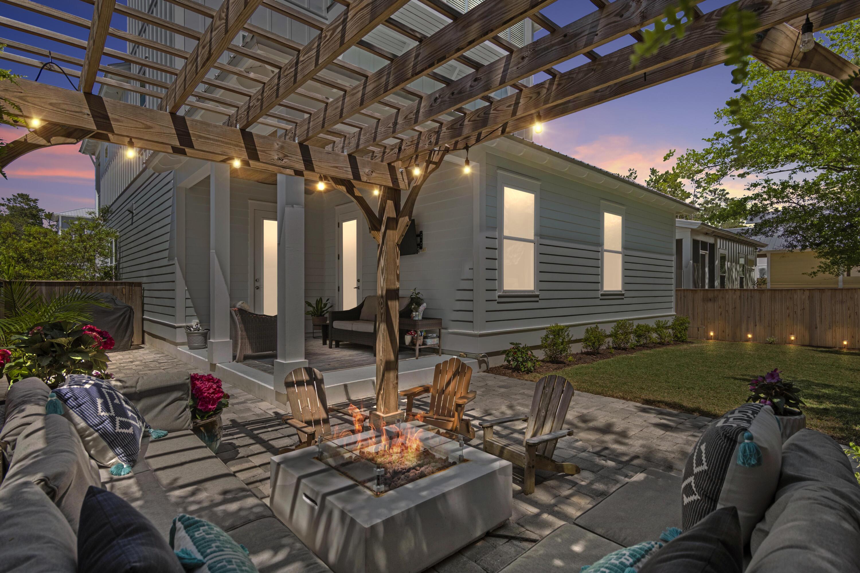 48 Lake Mist Ln Inlet Beach Inlet Beach, FL 32461 - Photo 6 of 78 Outdoor Entertainment Space at Dusk