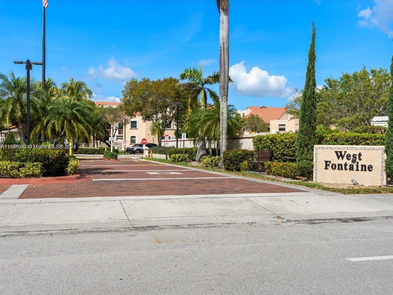 10253 Northwest 9th St Circle, Unit 4076 Miami, FL 33172 - Photo 1 of 11 a sign that is on the side of a road