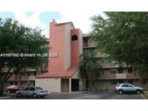 10253 Northwest 9th St Circle, Unit 4076 Miami, FL 33172 - Photo 2 of 11 a view of multiple houses with a yard