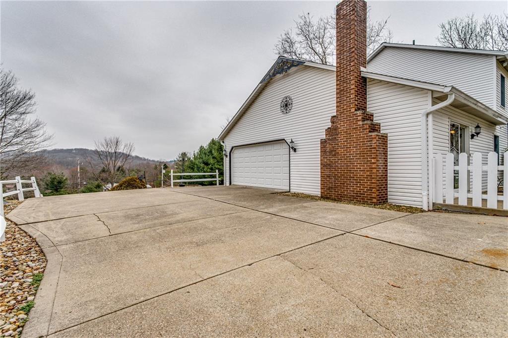 148 Mary Reed Road Baden, PA 15005 - Photo 20 of 25 Top of driveway offers plenty of room for parking an extra vehicle or turning around. Good space for a game of basketball or hockey.
