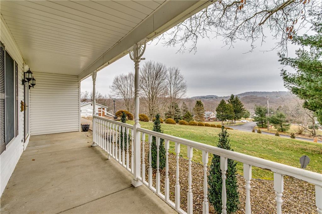 148 Mary Reed Road Baden, PA 15005 - Photo 23 of 25 Enjoy picturesque views from the 30x6 covered front porch. Limited step entry.