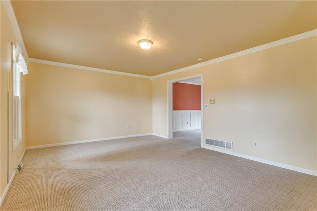 148 Mary Reed Road Baden, PA 15005 - Photo 9 of 25 Large living room (17x13) with new carpeting that extends into the dining room.