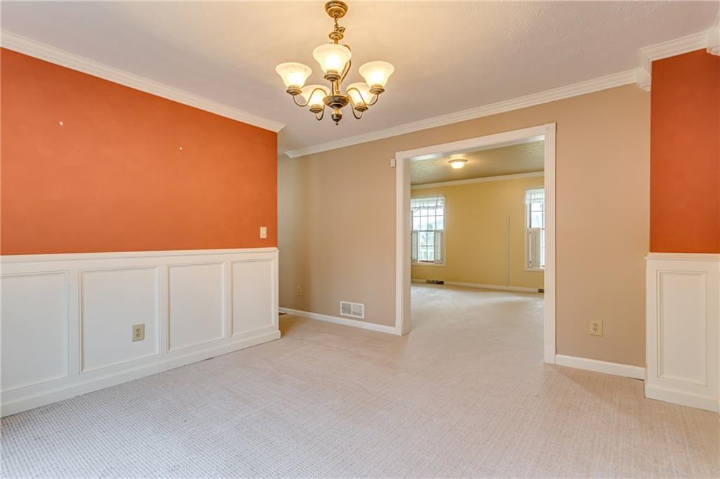 148 Mary Reed Road Baden, PA 15005 - Photo 10 of 25 Pretty wainscoting and crown molding dress up the dining room for entertaining. Room measures 13x12.