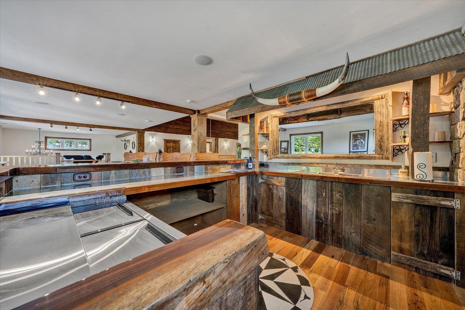 9945 Brooks Mill Road Wirtz, VA 24184 - Photo 13 of 50 a kitchen with stainless steel appliances granite countertop a sink and wooden cabinets