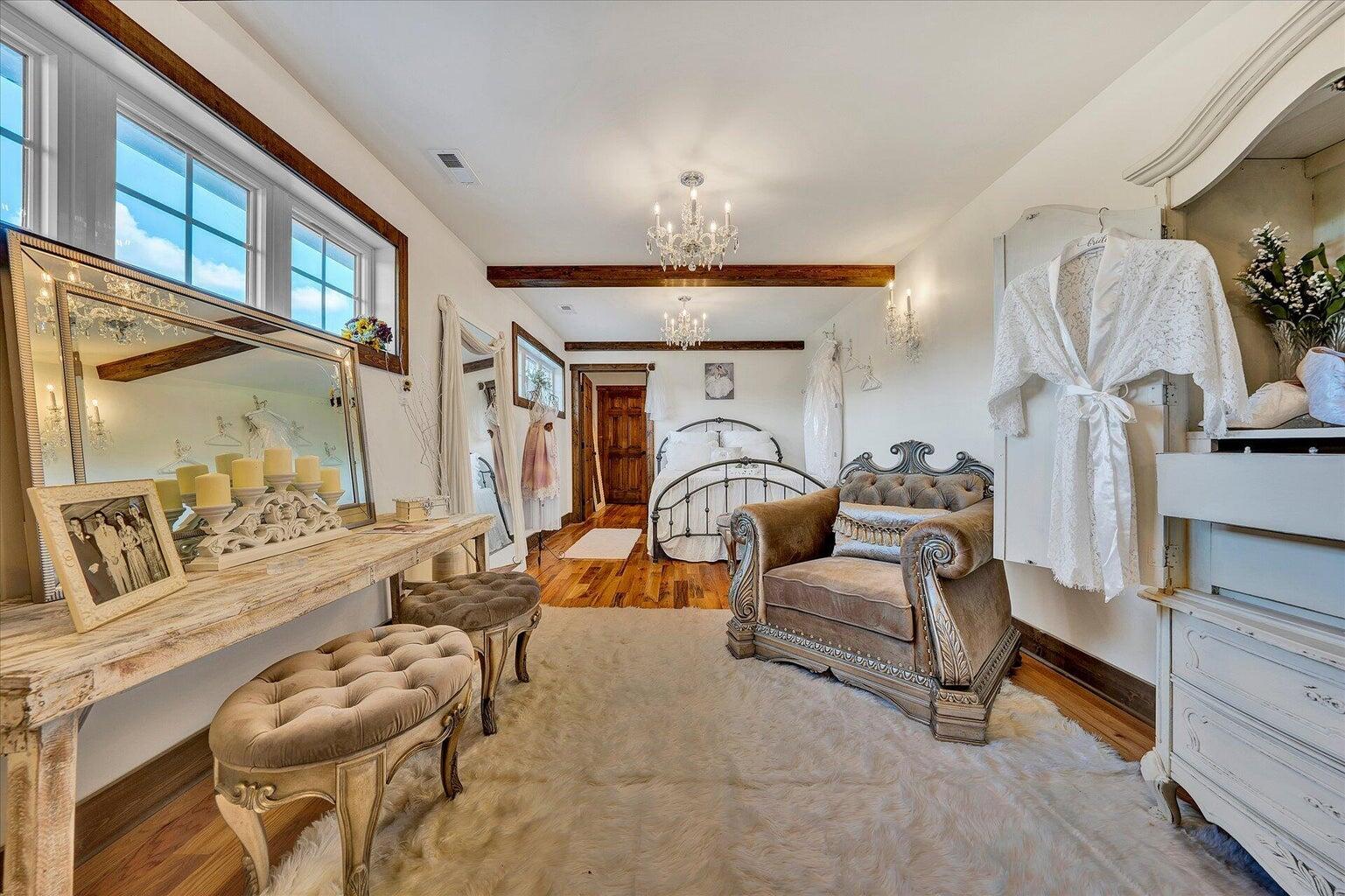 9945 Brooks Mill Road Wirtz, VA 24184 - Photo 18 of 50 a living room with furniture a rug and a chandelier