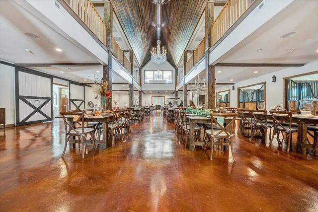 a living room with lots of furniture and a table