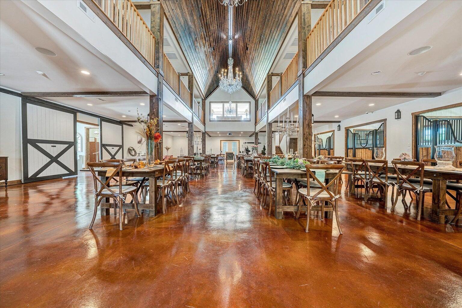 9945 Brooks Mill Road Wirtz, VA 24184 - Photo 29 of 50 a dining hall with lots of tables a large window and chairs