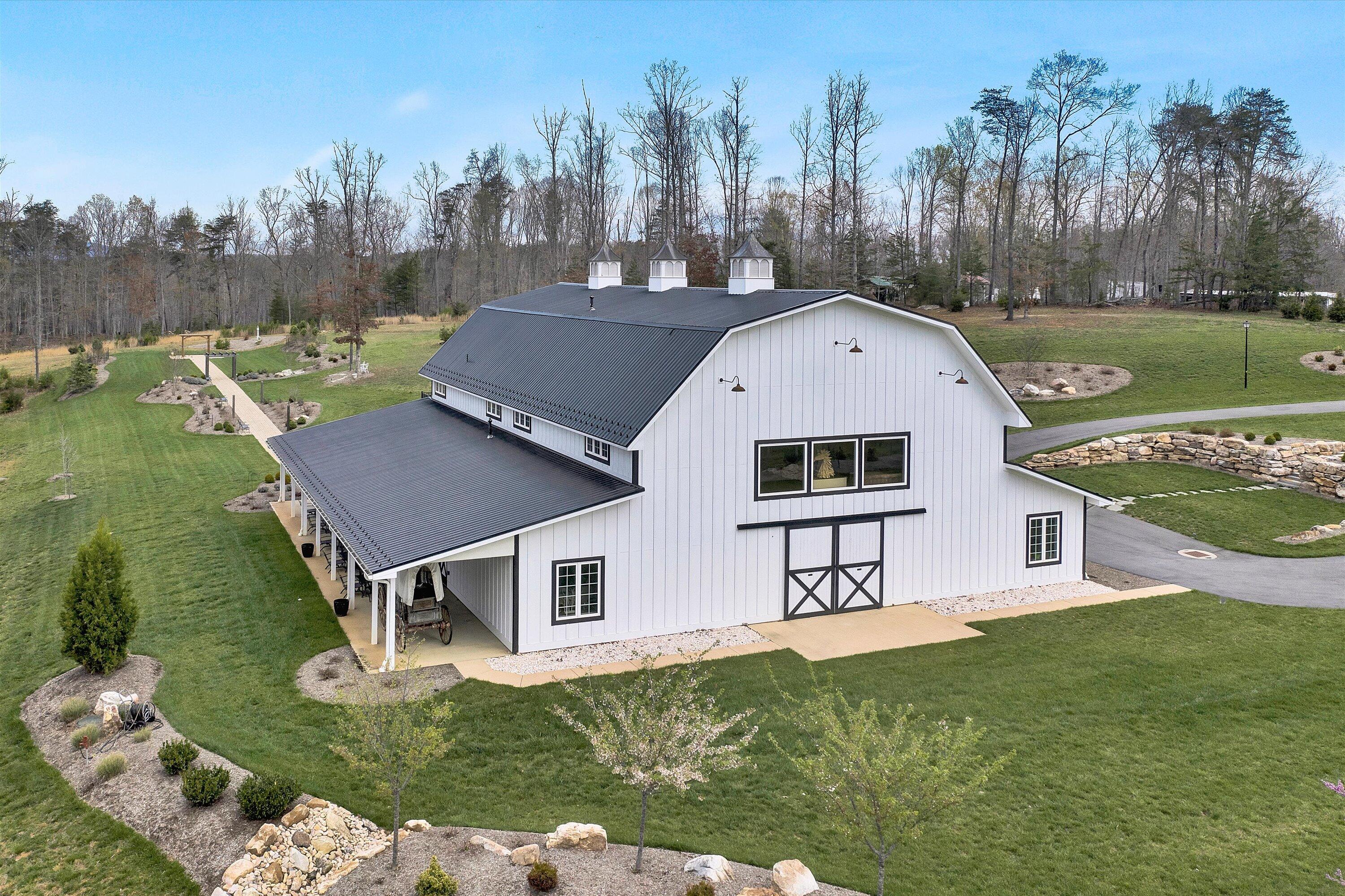 9945 Brooks Mill Road Wirtz, VA 24184 - Photo 36 of 50 a front view of a house with garden
